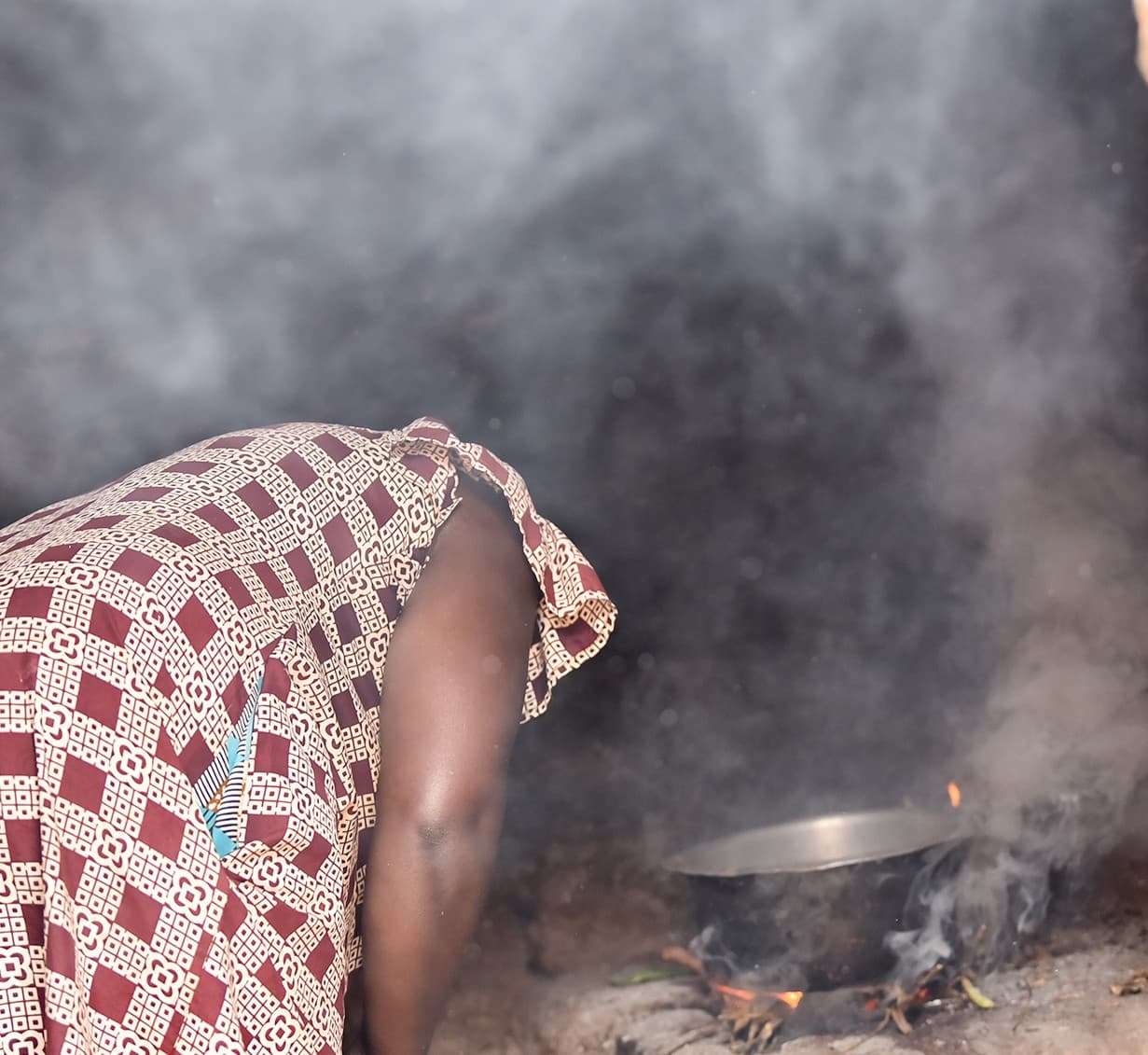 RRS field researcher documenting indoor air pollution from a traditional cookstove