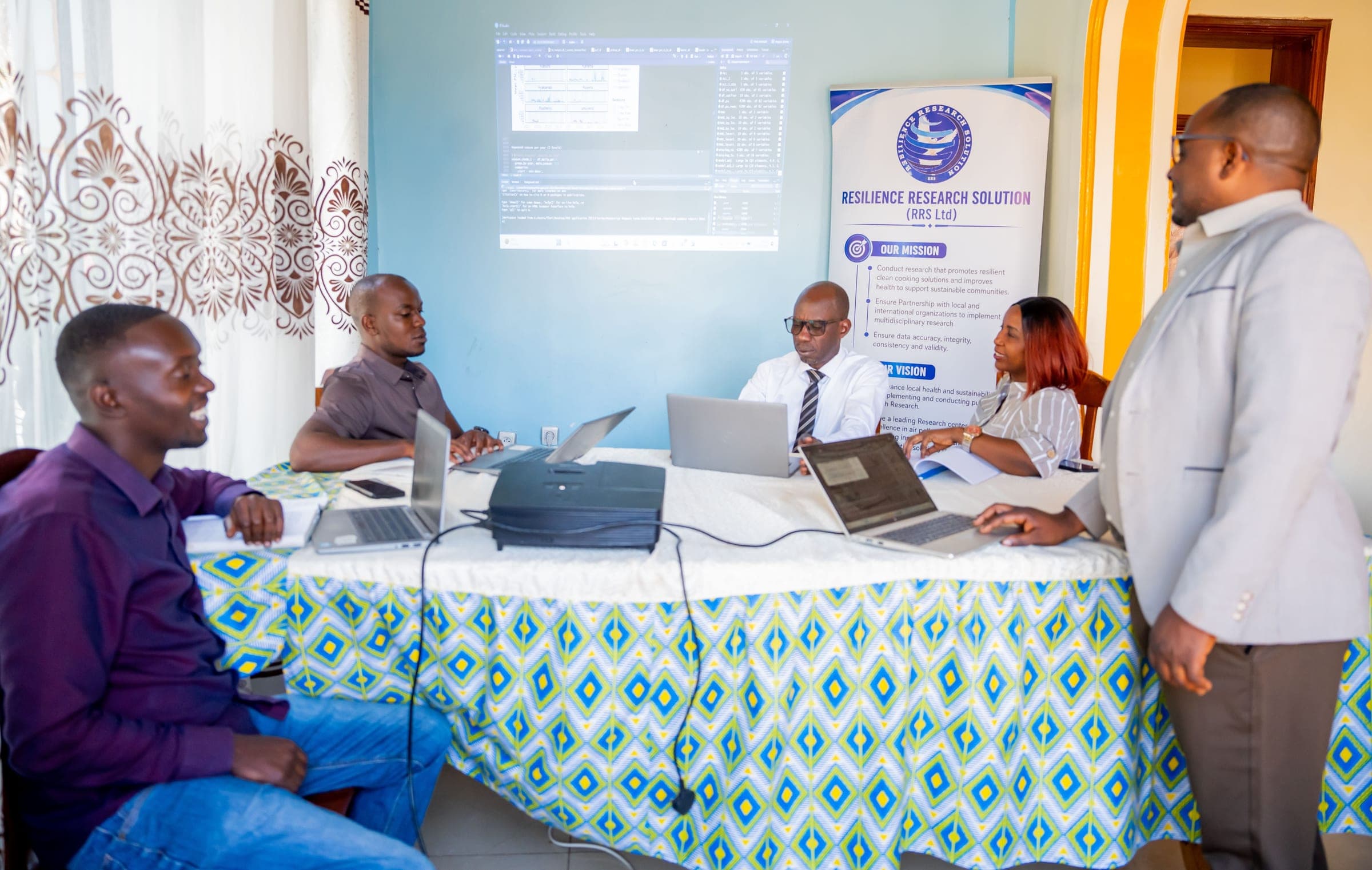 RRS researchers collaborating on a data analysis session in Rwanda